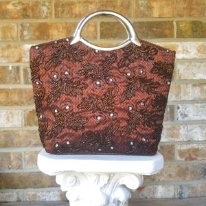 Gorgeous brown handbag with silver colored handle